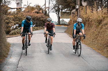 Three cyclists